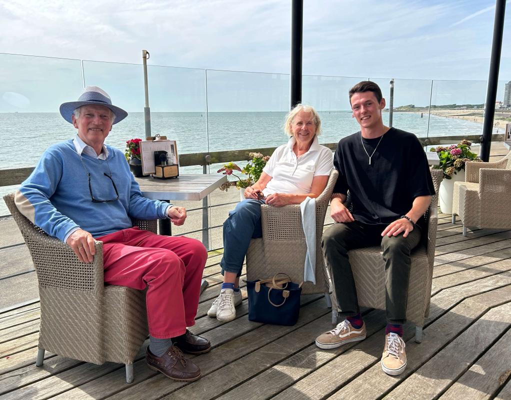 Yurii and his Dutch grandparents near the beach