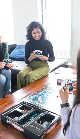 Students playing a game in a student house