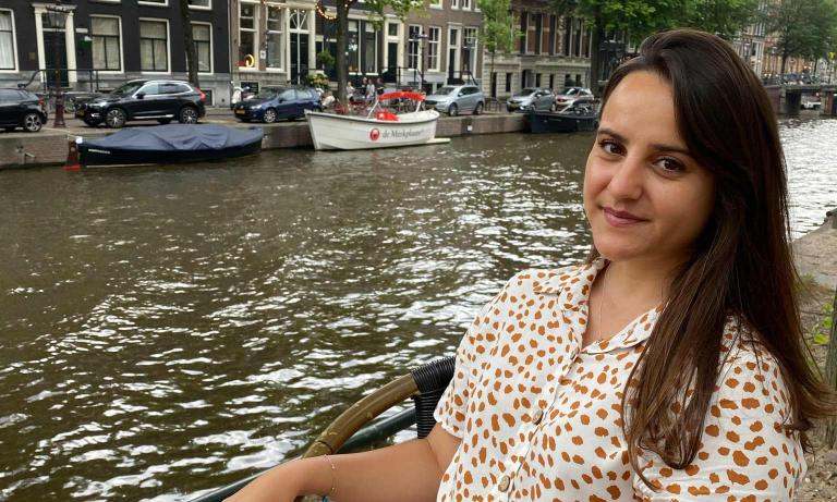 Deniz at a canal in Amsterdam