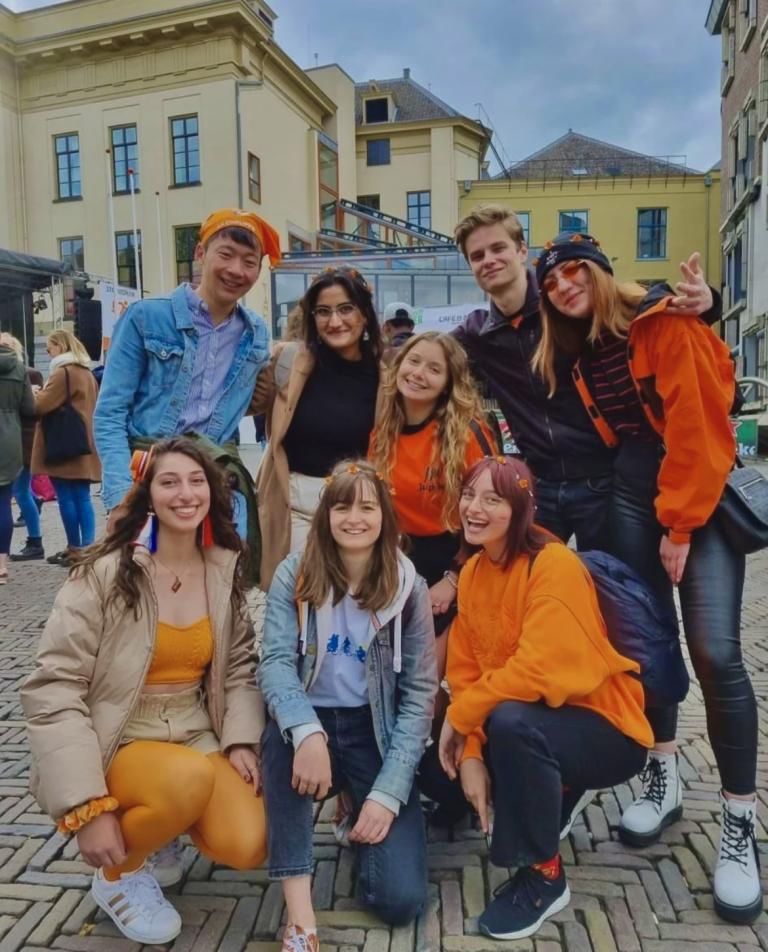 Giusy and friends wearing orange clothes on King's day