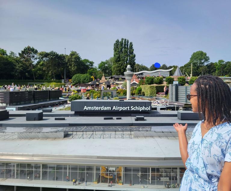 Girl pointing at the miniature Amsterdam Airport Schiphol at Madurodam