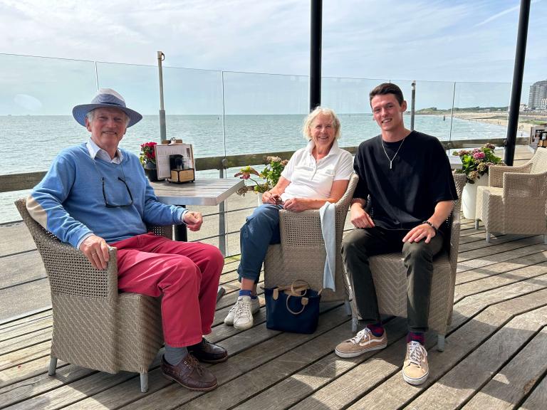 Yurii and his Dutch grandparents near the beach