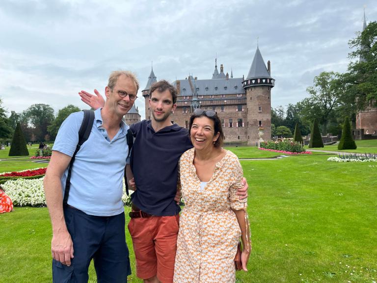 Maartje, Jaap, and their son Bram in front of a castle